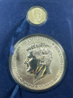 One 1964 90% Silver Kennedy Half & one Half Pound Kennedy 50th Anniversary Medal